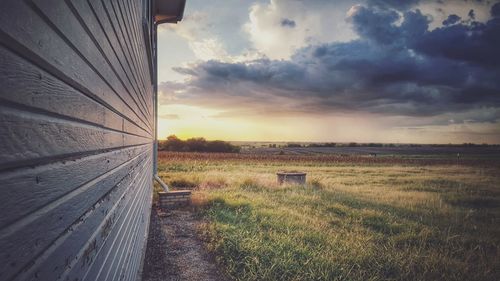 Scenic view of field against sky during sunset