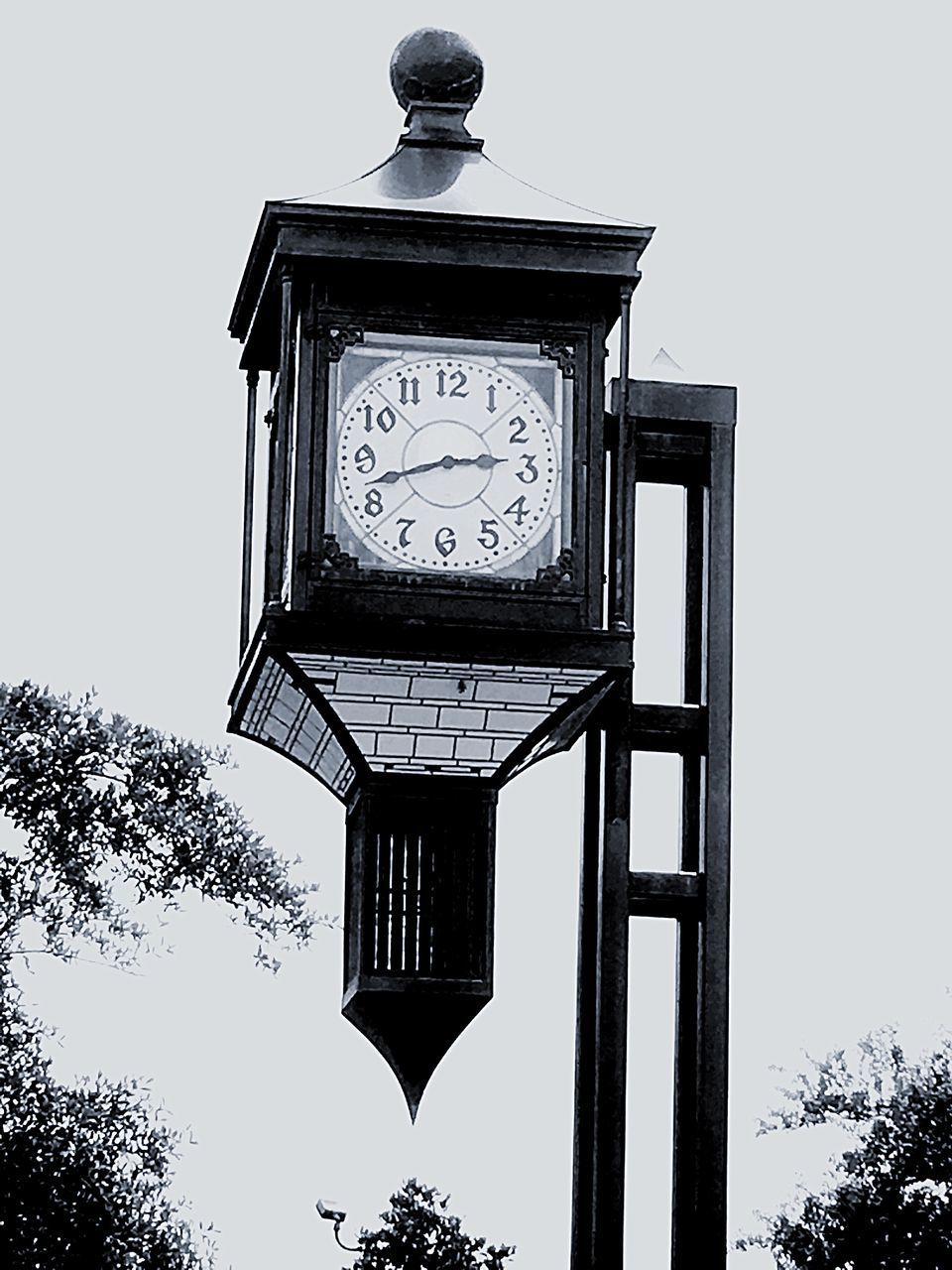 LOW ANGLE VIEW OF CLOCK AGAINST SKY