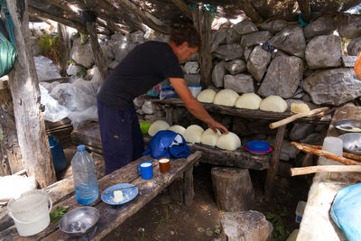 Side view of man working at dusk