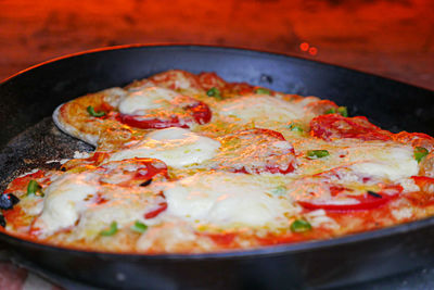 Close-up of pizza in pan