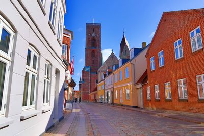 Street amidst buildings against sky