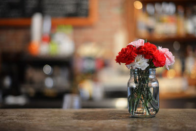 Close-up of flowers in mason jar