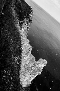 High angle view of rock on sea shore