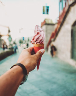 Midsection of person holding ice cream cone