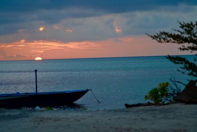 Scenic view of sea against sky at sunset