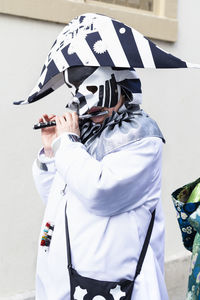 Rear view of man with woman standing against white background