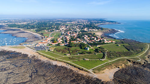 High angle view of steps by sea against sky