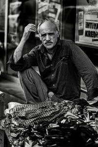 Portrait of man sitting in store