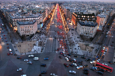 High angle view of busy street amidst buildings in city