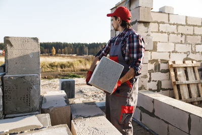 Mason working at construction site