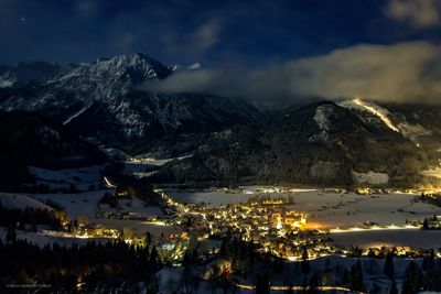 View of town at night during winter