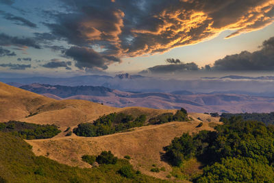 Scenic view of landscape against sky during sunset