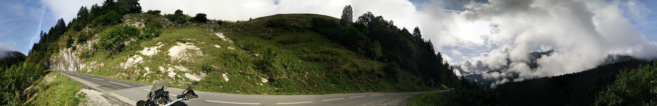 Panoramic view of landscape against cloudy sky