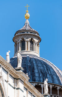 Low angle view of building against blue sky