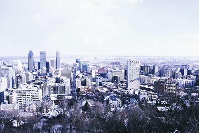 Aerial view of cityscape against sky