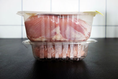 Close-up of raw meat in plastic packages producing too much plastic waste