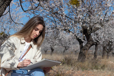 Young woman using digital tablet