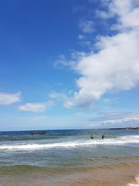 Scenic view of sea against cloudy sky