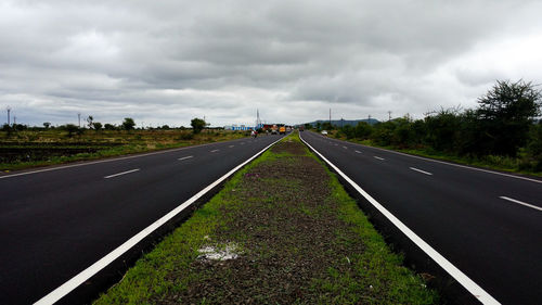 View of road against cloudy sky