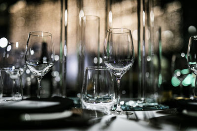 Close-up of wine glasses on table