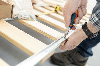 Midsection of man working on paper