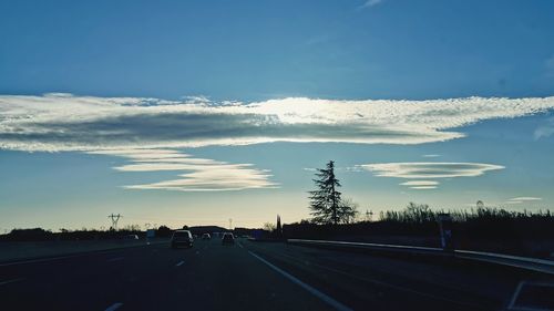 Highway against sky during sunset