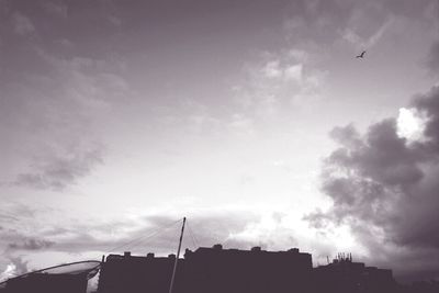 Low angle view of building against cloudy sky