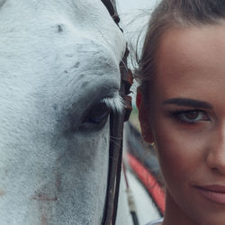 Close-up of woman with horse