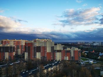 High angle view of buildings in city against sky