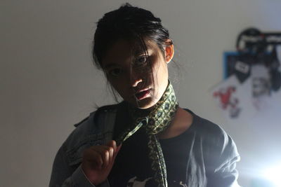 Portrait of serious woman wearing necktie