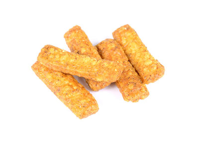 High angle view of bread in plate against white background