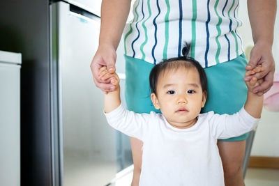 Portrait of cute baby at home