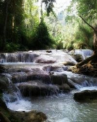 Scenic view of river flowing through rocks