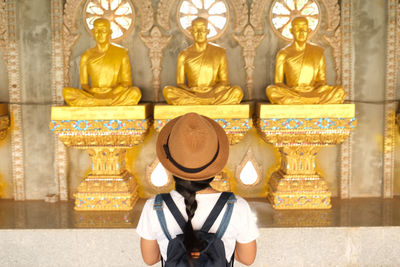 Midsection of sculpture in temple outside building