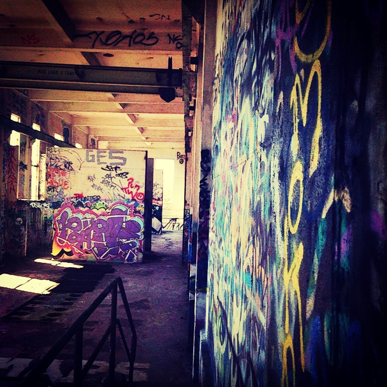 indoors, graffiti, built structure, architecture, abandoned, door, art, wood - material, wall - building feature, old, house, art and craft, creativity, wall, multi colored, messy, window, no people, entrance, damaged