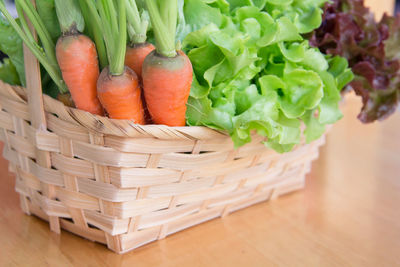 High angle view of vegetables in basket on table