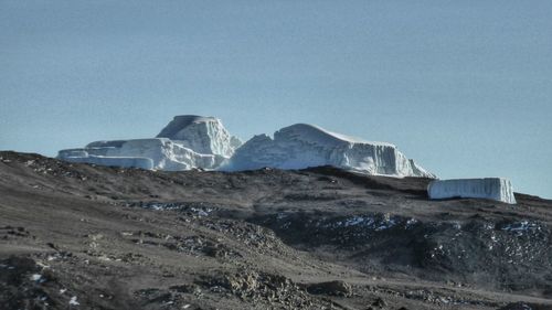 View of landscape against blue sky