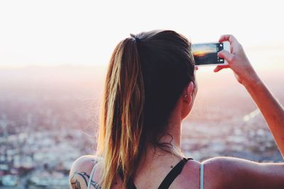 Woman photographing with smart phone