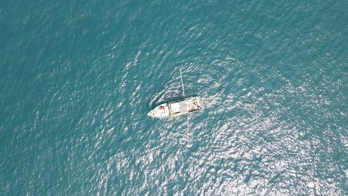 High angle view of boat sailing in sea