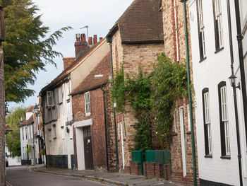 Street amidst houses and buildings in town