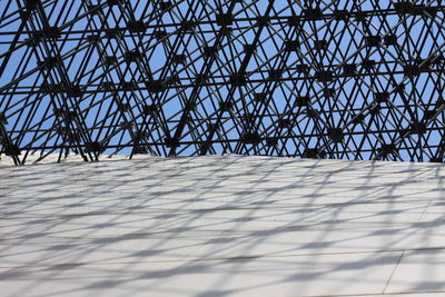 Low angle view of metallic structure against sky