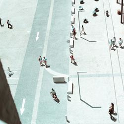 High angle view of people walking on street in city