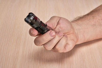 High angle view of human hand on table