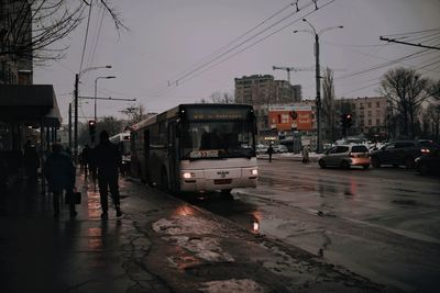 View of city street and buildings during rainy season