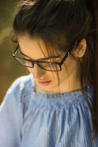 Close-up of beautiful young woman in eyeglasses
