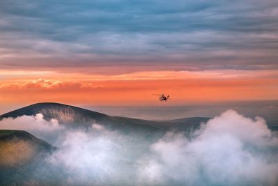 Scenic view of mountains against sky during sunset