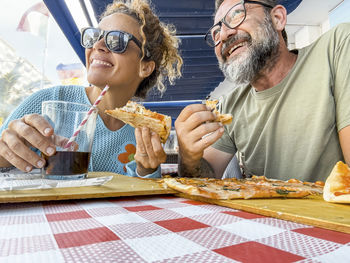 Friends having food at table