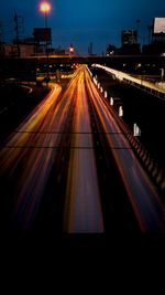 High angle view of light trails on road in city