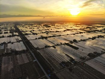 High angle view of city during sunset