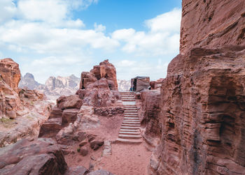 Low angle view of rock formations against sky